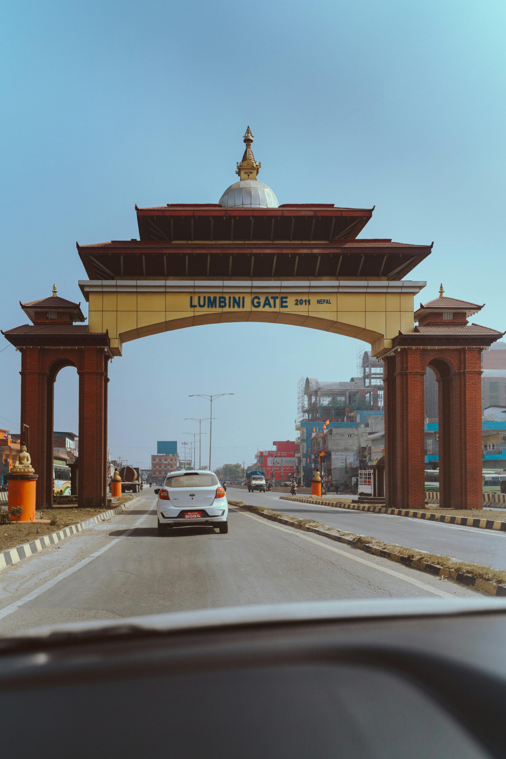 Scenic view of the Lumbini Gate landmark with cars on a sunny day. Perfect for travel imagery.